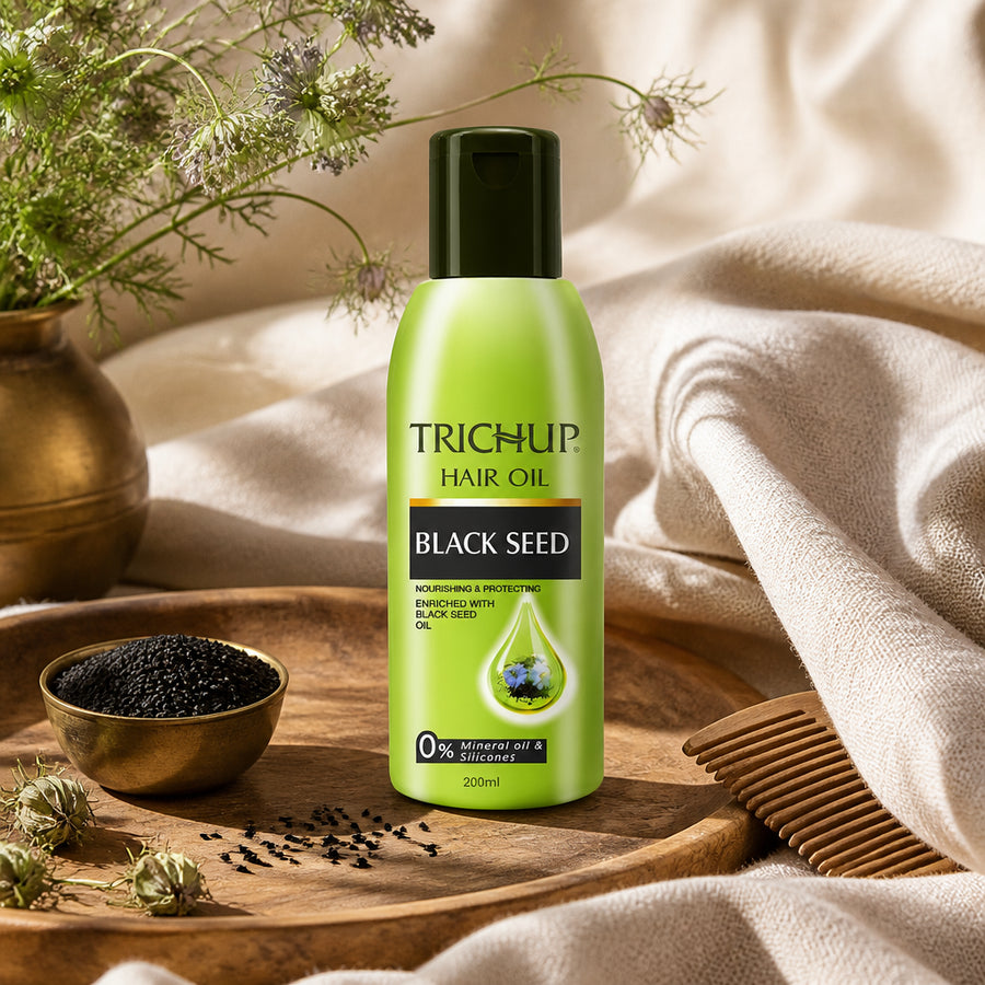 Huile capillaire à la Graine de Nigelle Trichup 200 mL — vue lifestyle ambiance ayurvédique