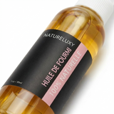 Gros plan sur l'étiquette du flacon d'huile de fourmi Natureluxy 30 ml, 100 % naturelle