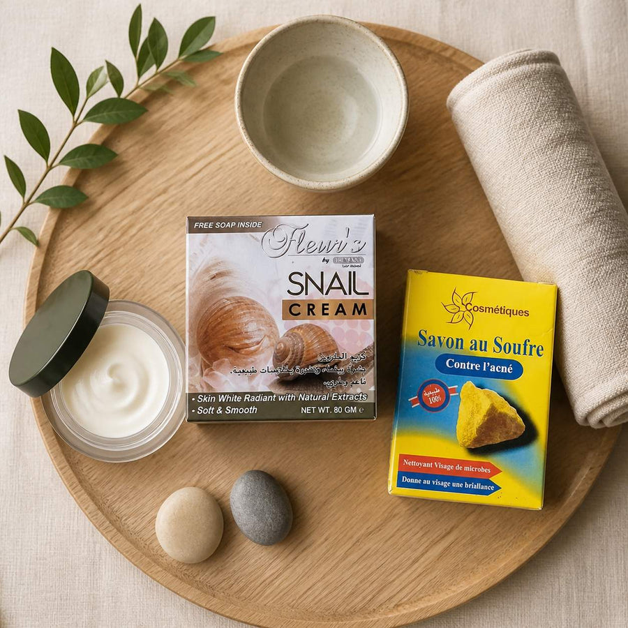 1 Crème à la bave d'escargot + 1 Savon soufre Fabio 80g – rituel d'utilisation vu du dessus, ambiance naturelle zen