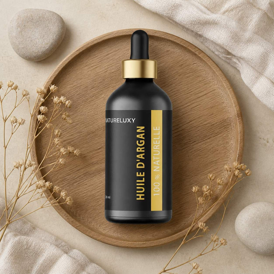 2×100 mL Huile d’Argan 100% Naturelle – Pipette – Soin Peau & Cheveux – composition flat lay avec éléments naturels, vue du dessus