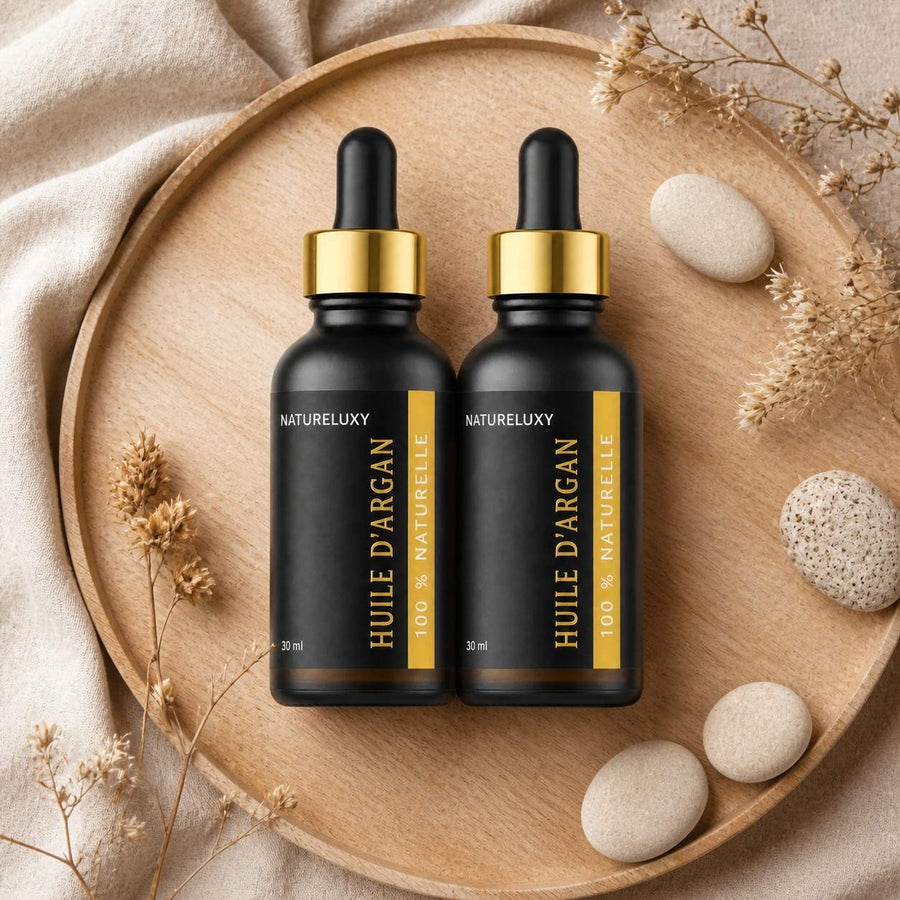 Lot de 2 Huiles d’Argan 30 ml Pipette — 100% naturelle, Soin visage corps cheveux (2×30 ml) – composition flat lay avec éléments naturels, vue du dessus