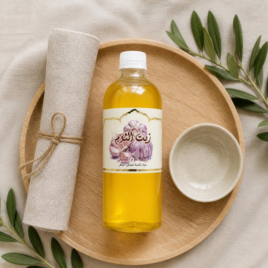 2X1L Huile d'Ail Cosmétique – rituel d'utilisation vu du dessus, ambiance naturelle zen