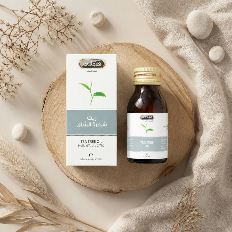 3 Huile d'Arbre à Thé 30mL 100% Naturelle Hemani – composition flat lay avec éléments naturels, vue du dessus