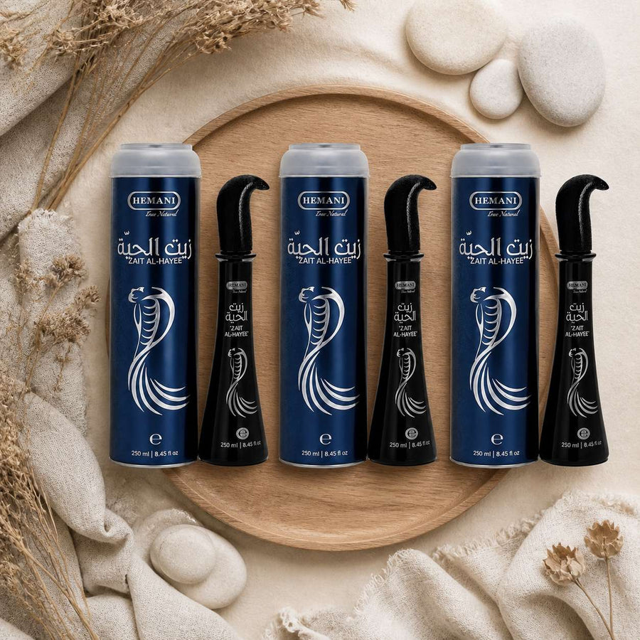 3 Huiles de Serpent pour cheveux Zait Al Hayee - Hemani - 250 ml – composition flat lay avec éléments naturels, vue du dessus