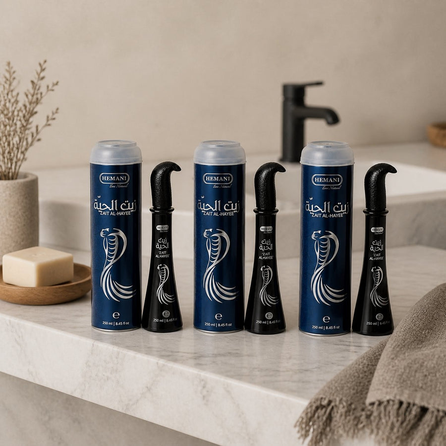 3 Huiles de Serpent pour cheveux Zait Al Hayee - Hemani - 250 ml – présentation du produit dans une salle de bain lumineuse et naturelle