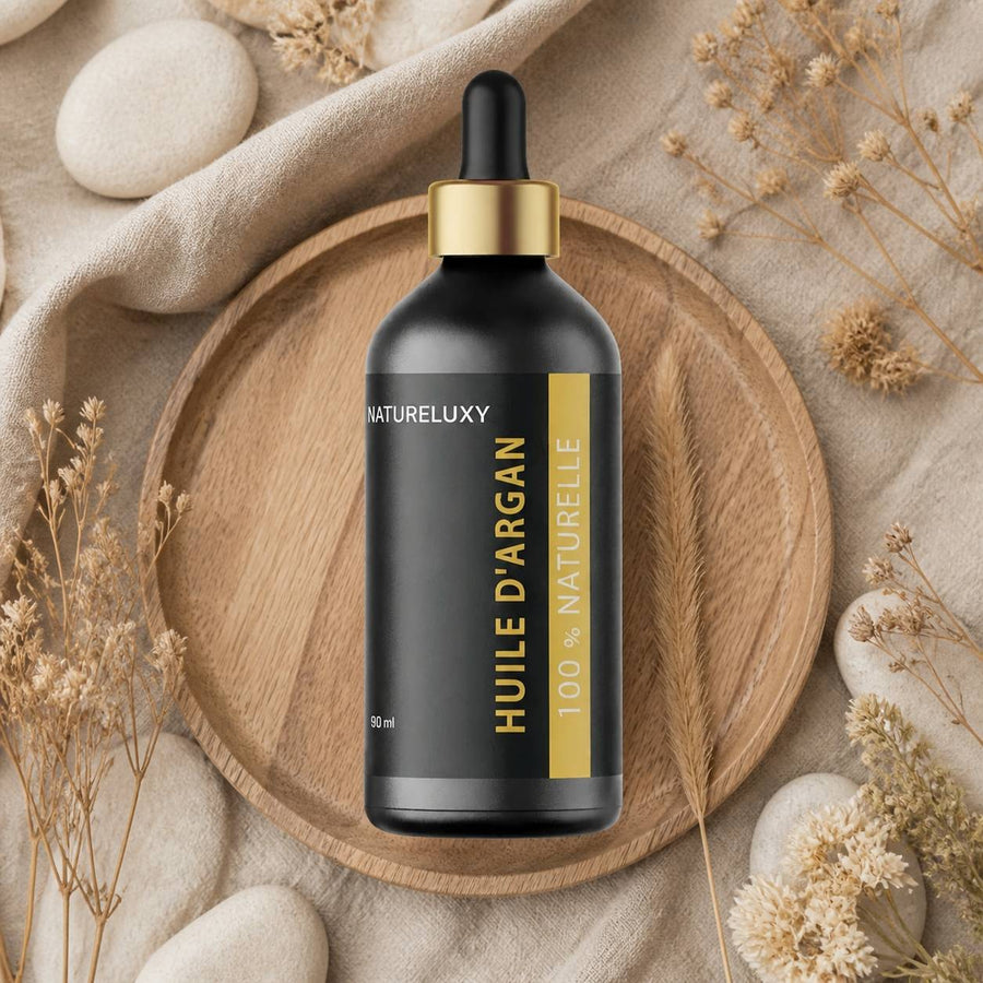 Lot 5× Huile d’Argan 100 ml Pipette – 100% naturelle, soin visage corps & cheveux (Origine Maroc) – composition flat lay avec éléments naturels, vue du dessus