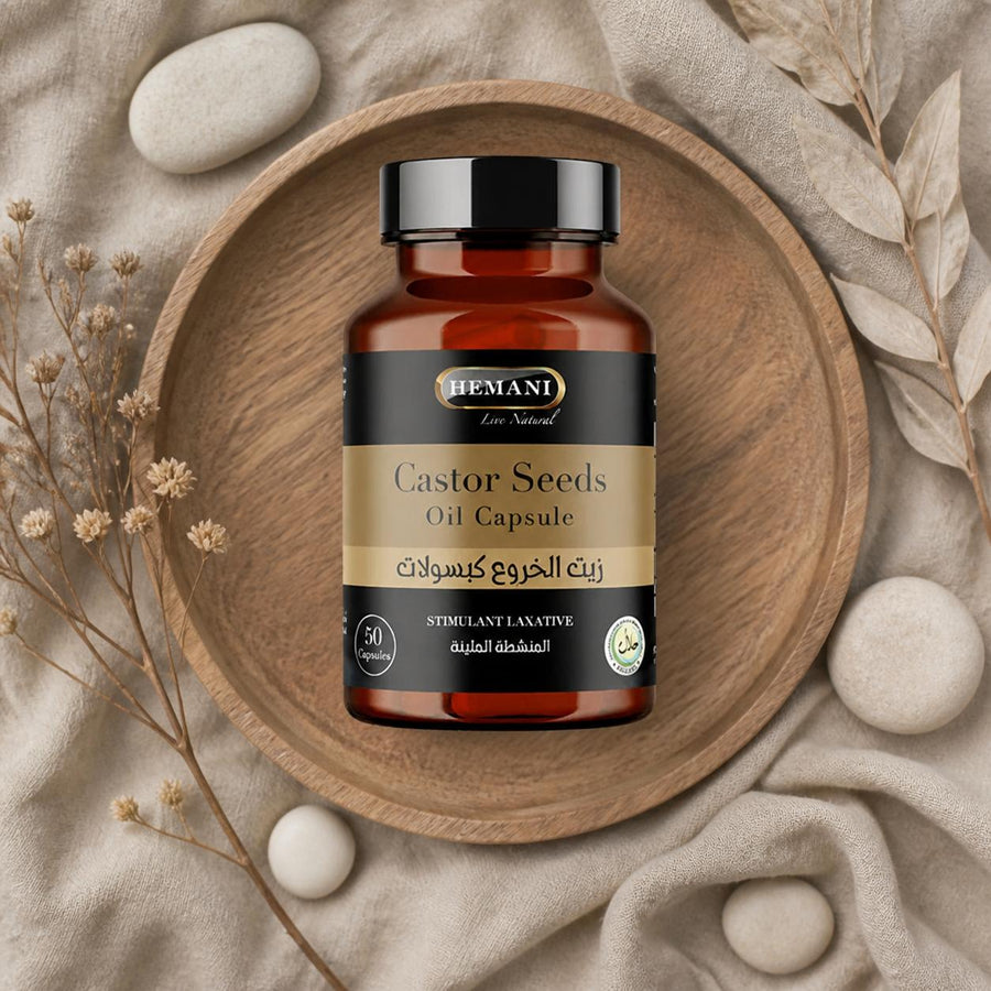 50 Capsules à l'huile de Graine de Ricin - Hemani – composition flat lay avec éléments naturels, vue du dessus