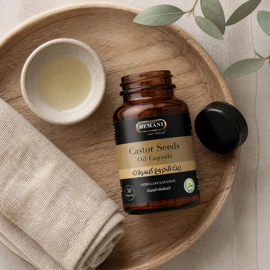 50 Capsules à l'huile de Graine de Ricin - Hemani – rituel d'utilisation vu du dessus, ambiance naturelle zen