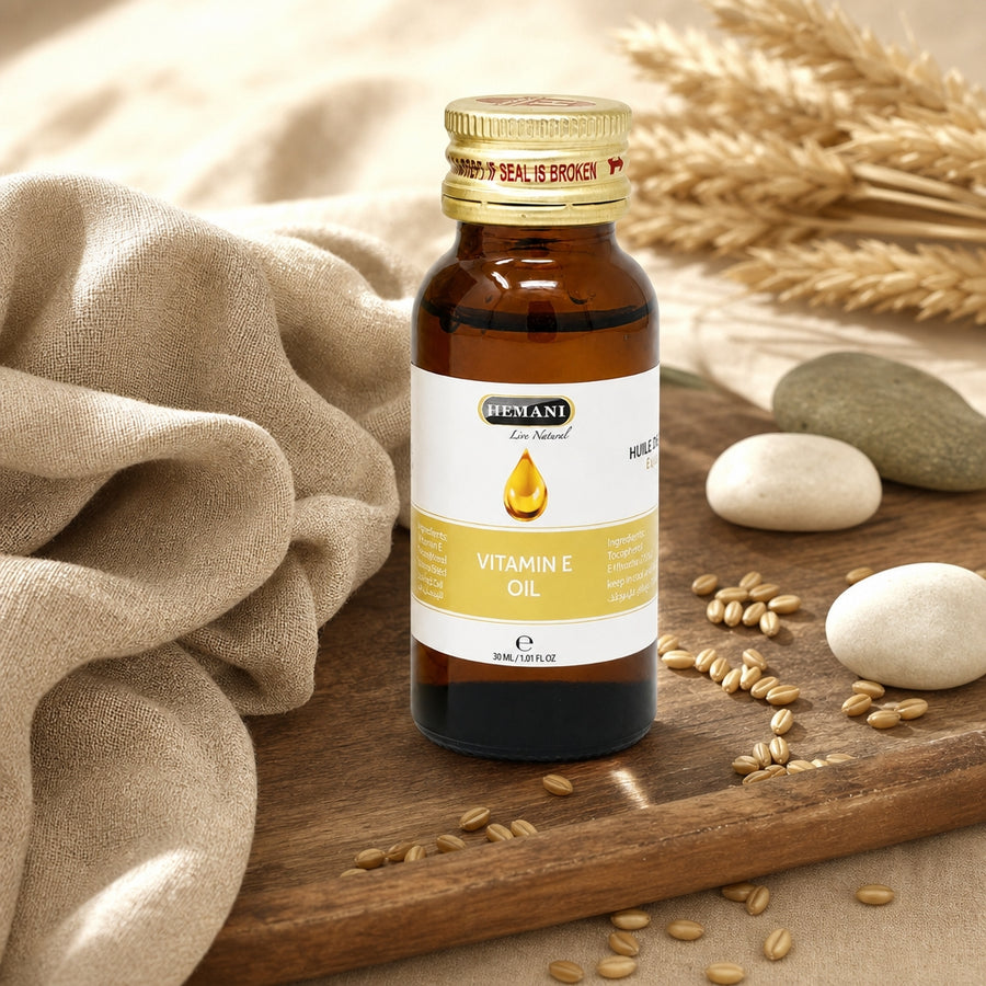 Huile de Vitamine E 30 mL Hemani - ambiance lifestyle sur plateau noyer et lin 100% naturelle