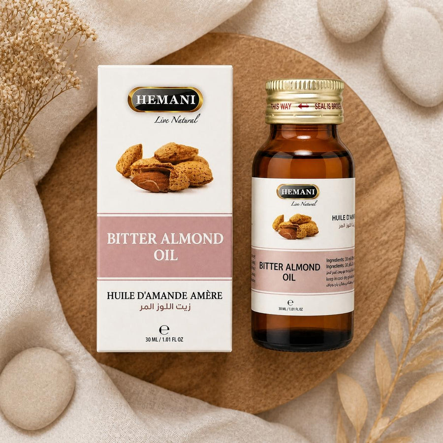 Huile d'Amande Amère 30ml Hemani – composition flat lay avec éléments naturels, vue du dessus