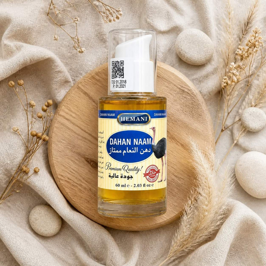 Huile d'Autruche - massage - douleur musculaire - 60mL Hemani – composition flat lay avec éléments naturels, vue du dessus