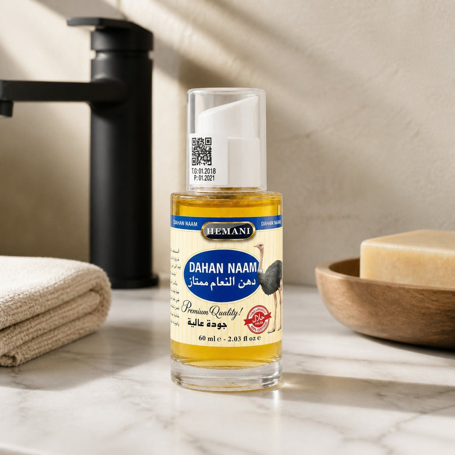 Huile d'Autruche - massage - douleur musculaire - 60mL Hemani – présentation du produit dans une salle de bain lumineuse et naturelle