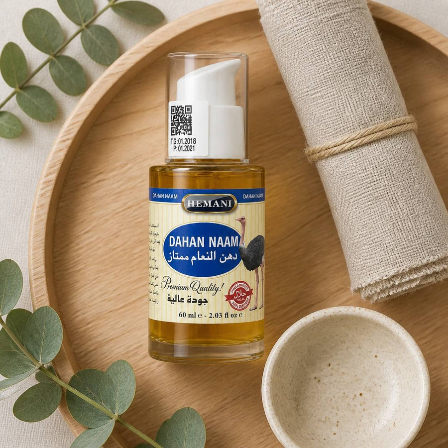 Huile d'Autruche - massage - douleur musculaire - 60mL Hemani – rituel d'utilisation vu du dessus, ambiance naturelle zen
