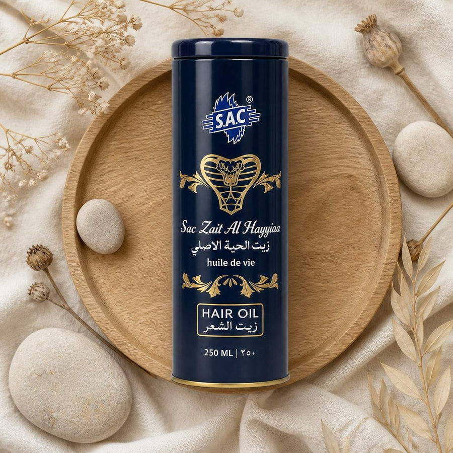 Huile de Serpent Zait Al Hayee 250 ml - Huile Capillaire – composition flat lay avec éléments naturels, vue du dessus