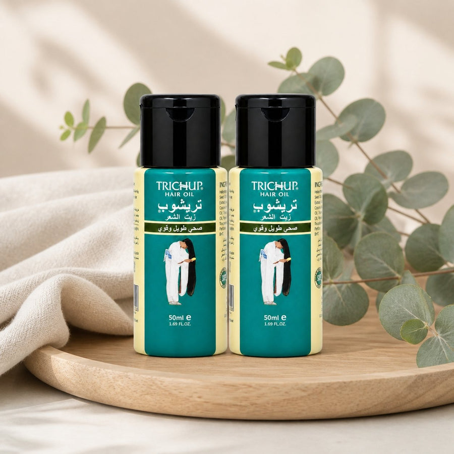 2 Huile Favorise la Pousse des Cheveux Soin Indien Trichup 50mL – composition sur plateau en bois