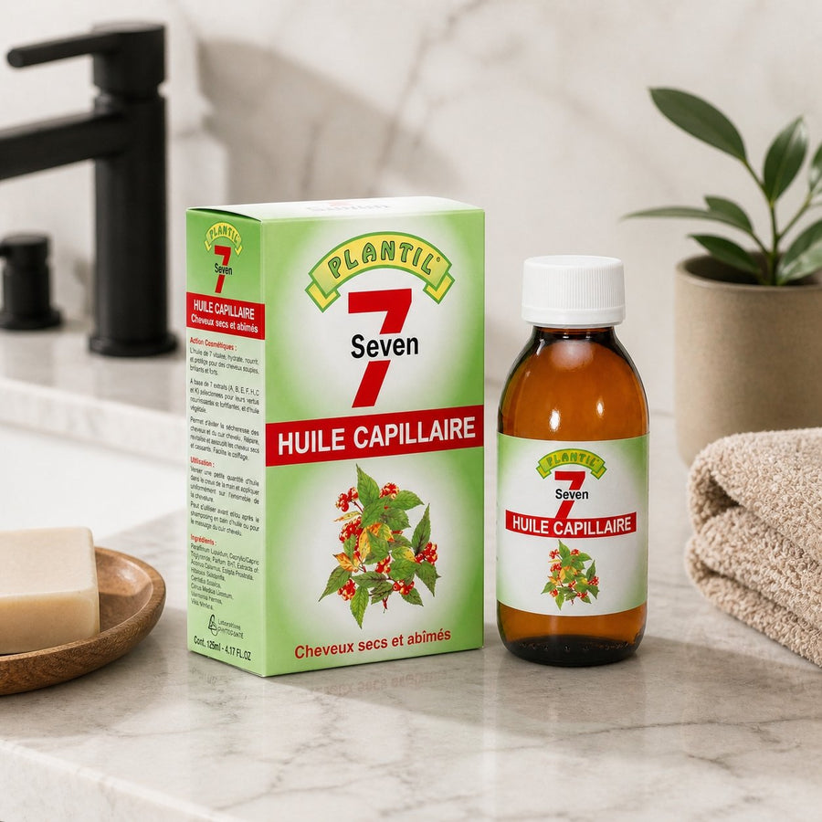 Mélange de 7 Huiles pour cheveux secs et abimés Plantil 125ml – présentation du produit dans une salle de bain lumineuse et naturelle