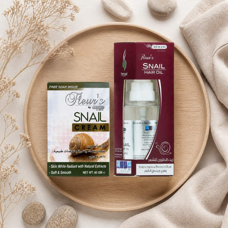 Pack 1 Crème à la bave d'escargot + 1 Huile d'escargot HEMANI 60ml – composition flat lay avec éléments naturels, vue du dessus