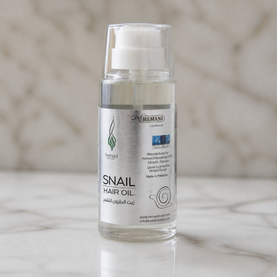 Pack 1 Crème à la bave d'escargot + 1 Huile d'escargot HEMANI 60ml – gros plan sur les détails et la finition du packaging