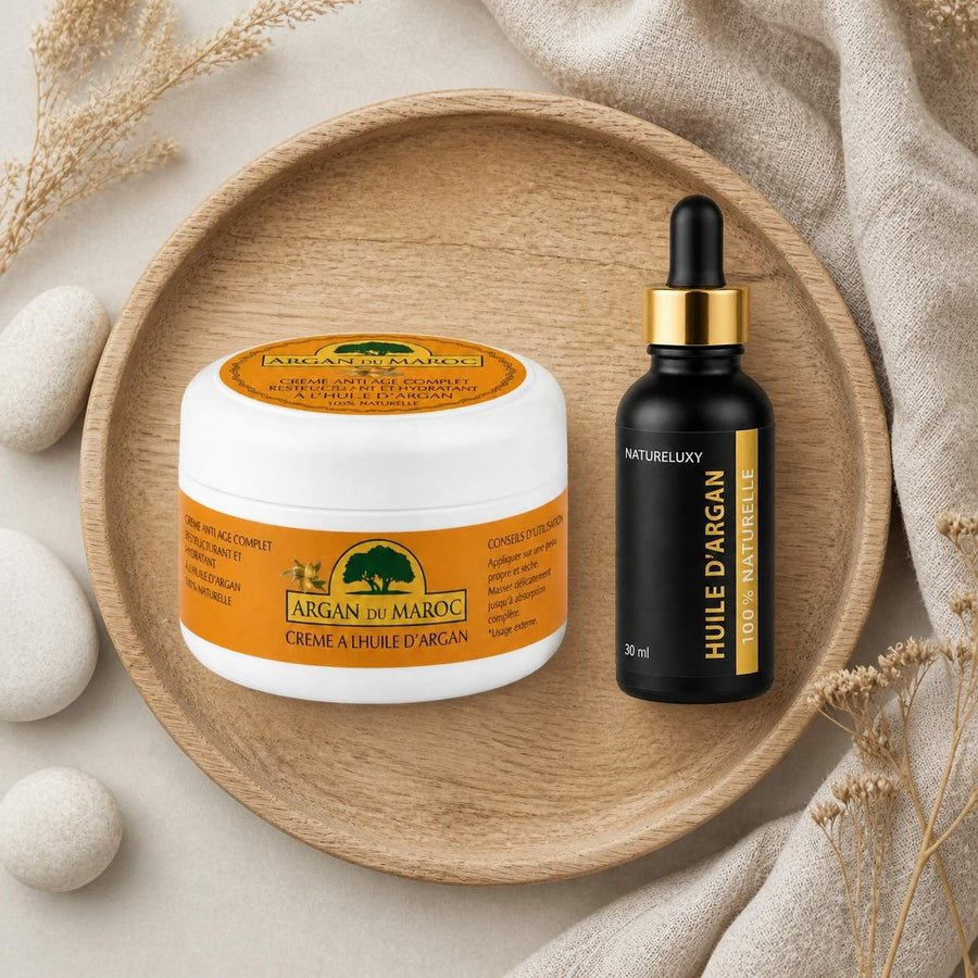 Pack Huile d'Argan 30mL Pipette + Crème à l'Huile d'Argan – composition flat lay avec éléments naturels, vue du dessus