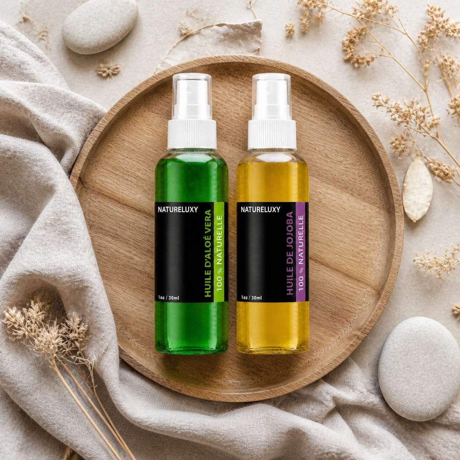 Pack Huile de Jojoba 30mL Spray + Huile d'Aloé Vera 30mL Spray – composition flat lay avec éléments naturels, vue du dessus