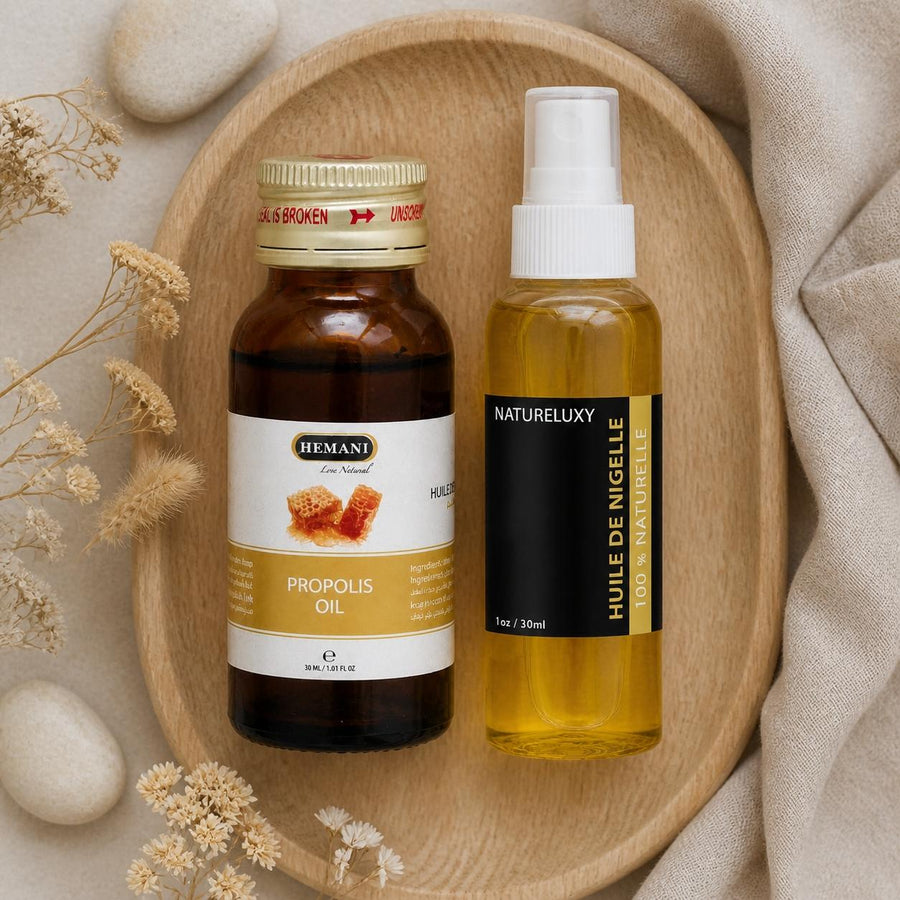Pack Huile de Nigelle 30mL Spay + Huile de Propolis 30mL Hemani – composition flat lay avec éléments naturels, vue du dessus