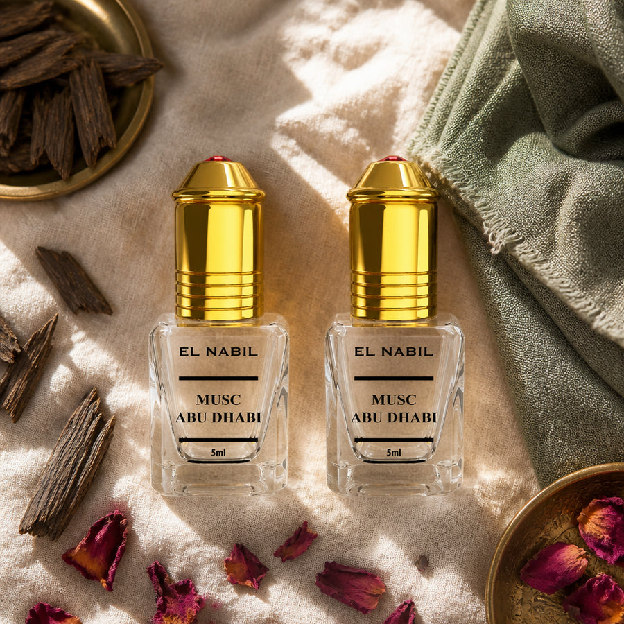 2X Musc Abu Dhabi avec applicateur Roll-On - 5mL - ambiance flatlay vue du dessus, packaging d'origine