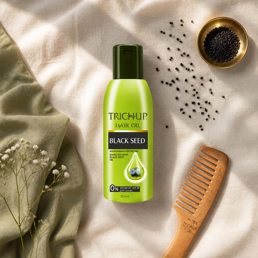 Huile capillaire à la Graine de Nigelle Trichup 200 mL — flatlay présentation éditoriale